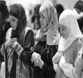 Women praying in the Mosque by Chris Keane
