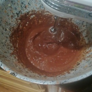 After boiling water, add 1/3 cup to chocolate mixture, blending well.  