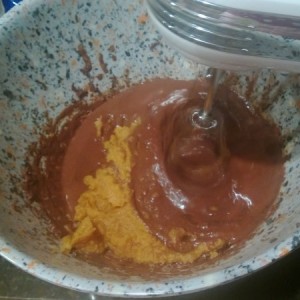 Add pumpkin, vanilla and sugar into the chocolate mixture, blending well.