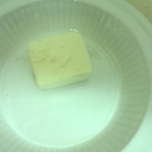 In a small microwave-safe dish, place butter in microwave for about 30 seconds until melted.
