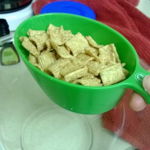 Measure out 3 cups of cinnamon cereal into large bowl.