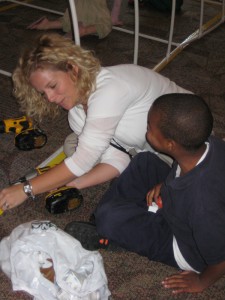 Da'Sean helps Mrs. Argus with the power drill!