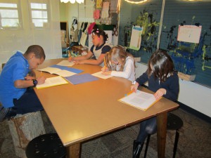 Kristien, J'Nayla, Olivia, and Sophia are all working on their math puzzles.