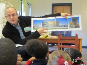 Mr. Eggink shows the class a computer generated picture of a building his company designed in Indy. 