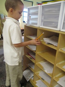 Jace used his paper foot to measure our mailboxes. 