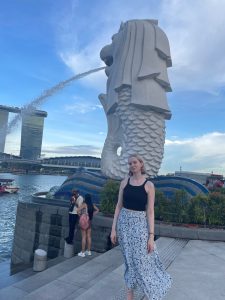 woman by statue in singapore