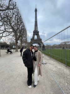 Jocelin and friend posing with Eiffel Tower behind them