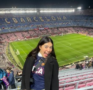 Jocelin posing with Camp Nou field behind her