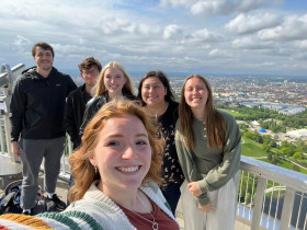 Nick and friends posing on top of the Olympic Tower with Munich in background