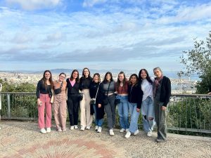 Julia and classmates overlooking Barcelona in the background