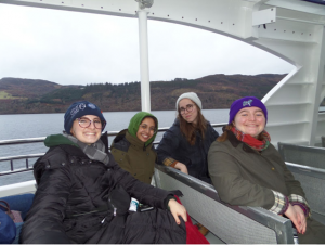 Gabi and 3 friends on a boat riding over Loch Ness.