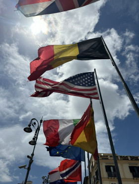Flags of multiple countries flying in Sorrento, Italy